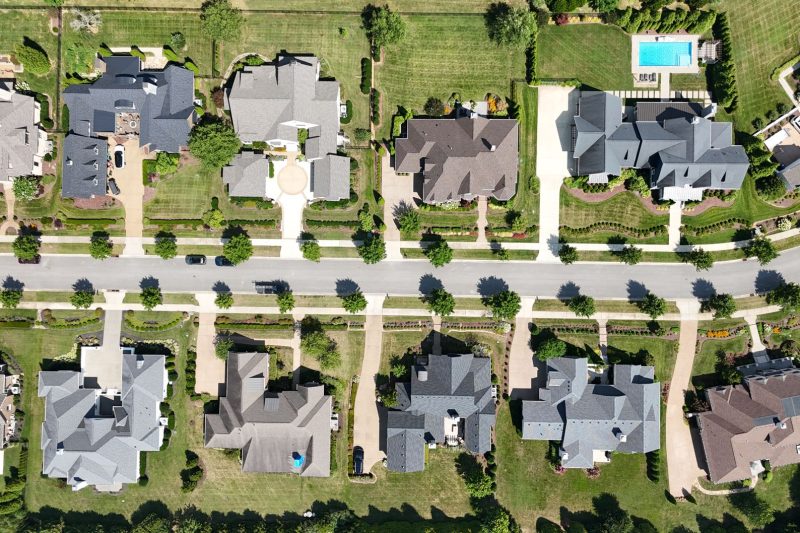 Overhead view of a suburban Tennessee neighborhood featuring modern homes and abundant greenery.